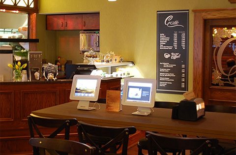 Computers at a bistro cafe table