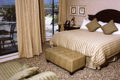 Bed and patio in hotel room