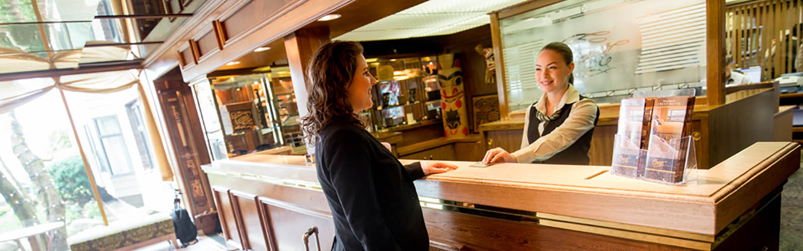 Woman checking into hotel