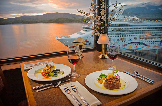 Table set for dinner looking over cruise ship