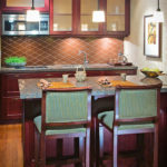 Two barstools and kitchenette