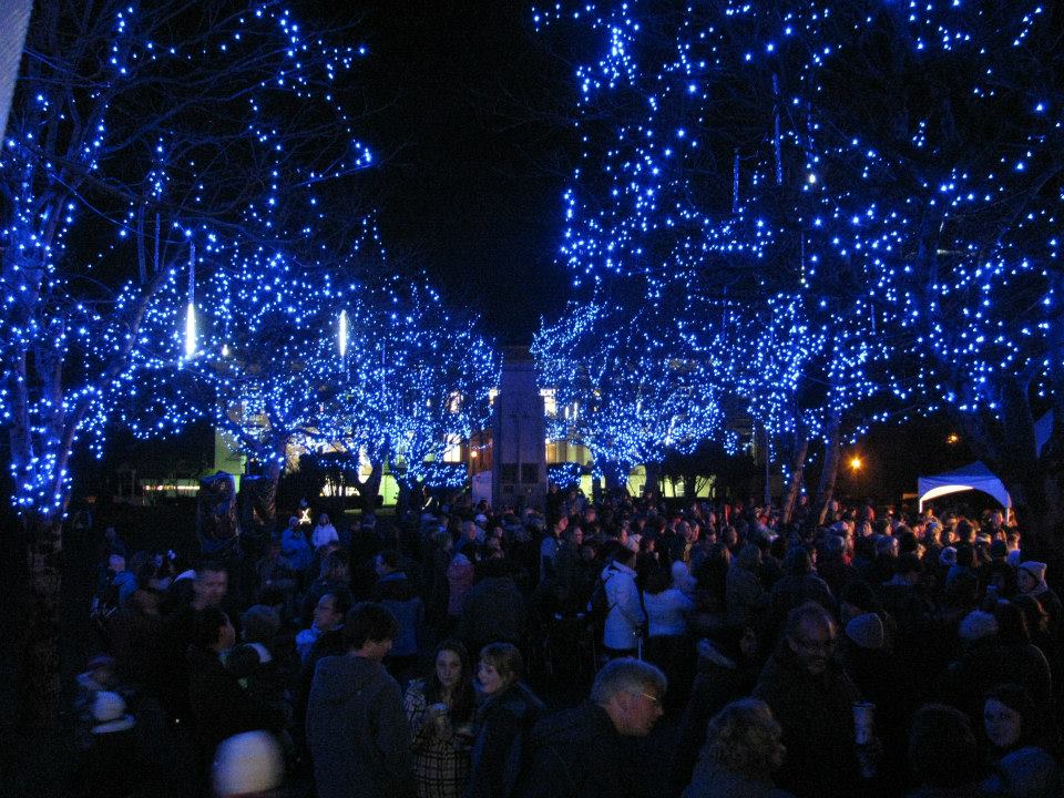 Winter festival with blue lights overhead
