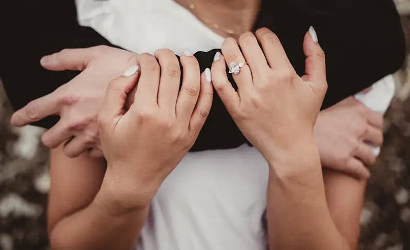 Husband and wife holding each other